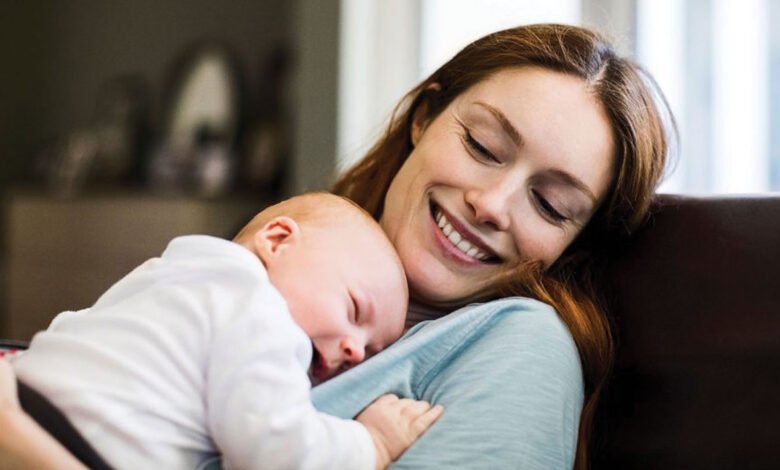 New mother holding her newborn baby