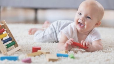 Baby enjoying tummy time with toys