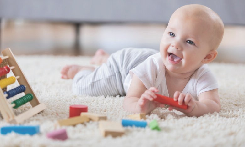 Baby enjoying tummy time with toys