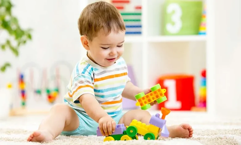 Baby playing with colorful toys